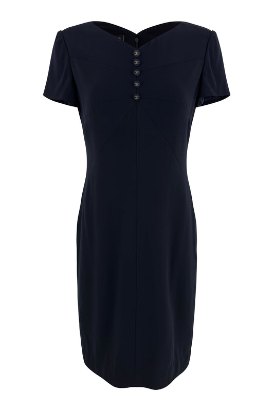Navy Chanel short-sleeve wool dress with sweetheart neckline and gold logo buttons on white background