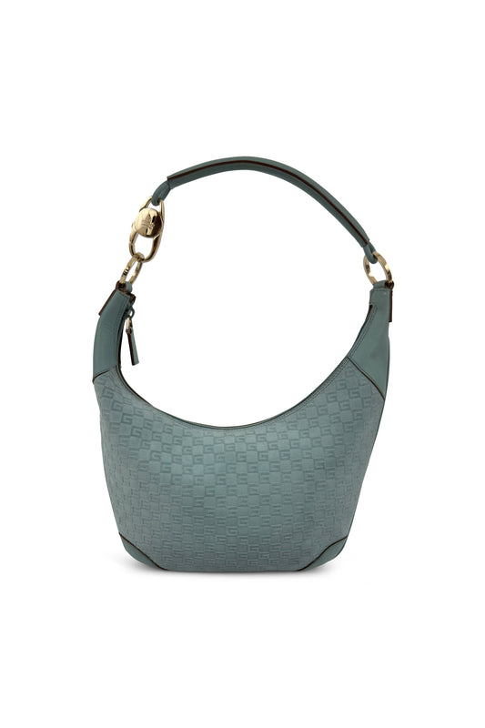 Baby blue Gucci monogram leather shoulder bag with curved silhouette and gold hardware on white background